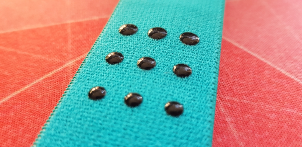 Rubber grip dots on the polar pro heart rate strap of the H10.
